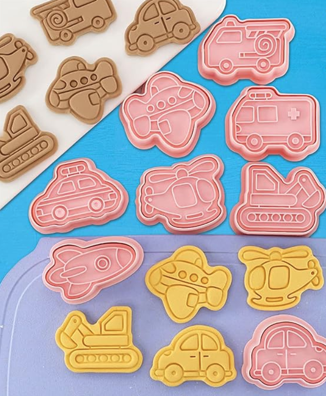 Modes of Transportation Cookie Cutters on display with examples of cookies shaped like cars, planes, etc