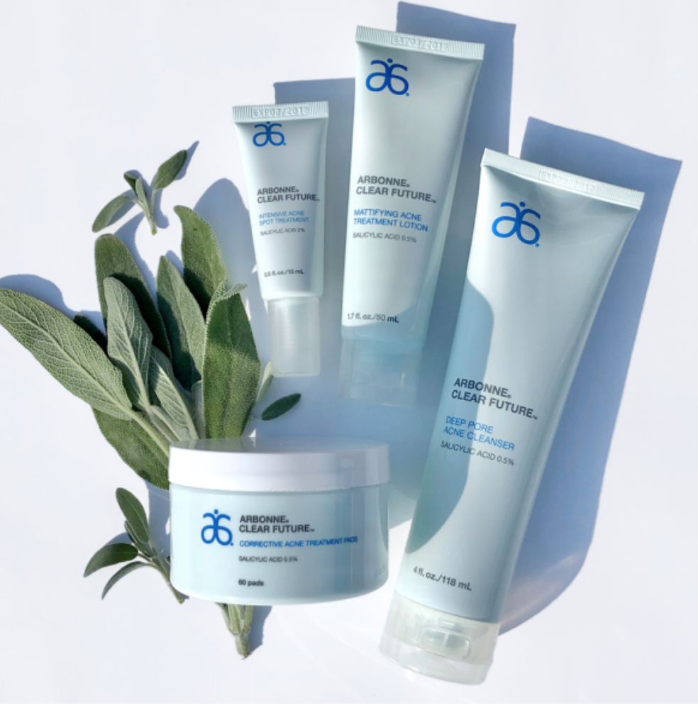 Arbonne HydrateMe Skincare Line on display with a splash of water and blue background